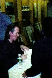 [Bill signing his book]